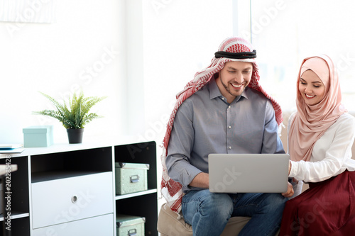 Muslim businessman with cow...