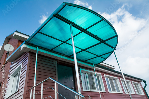polycarbonate canopy on the porch of the house photo