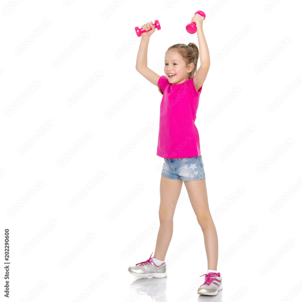 Little girl doing exercises with dumbbells. Little girl doing exercises with dumbbells.