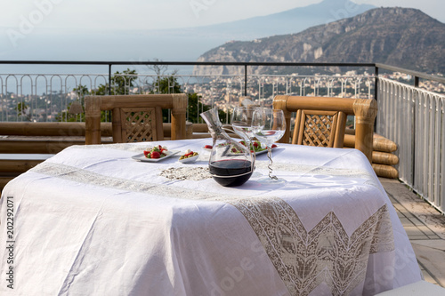 Prepared for supper table on the terrace overlooking the Bay of Naples and  Vesuvius. Sorrento. Italy © wjarek