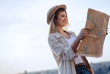 Tourist woman looking at map