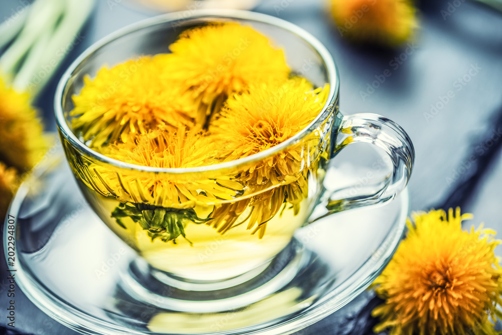Cup of dandelion tea on slate board Cup of dandelion tea on slate board