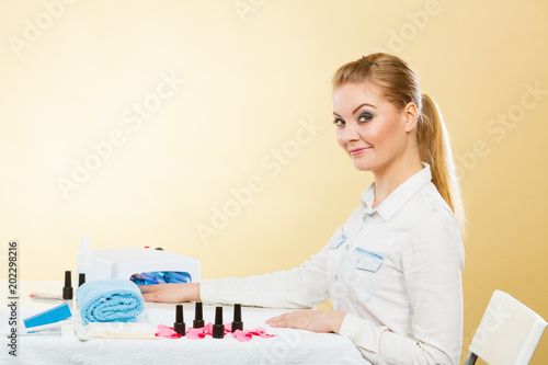 Smiling woman in spa wellness salon. photo