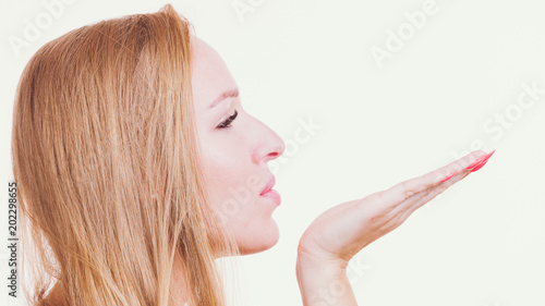 Woman sending air kiss