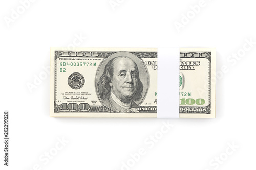 Stack of one hundred US Dollar money bills isolated on white background.