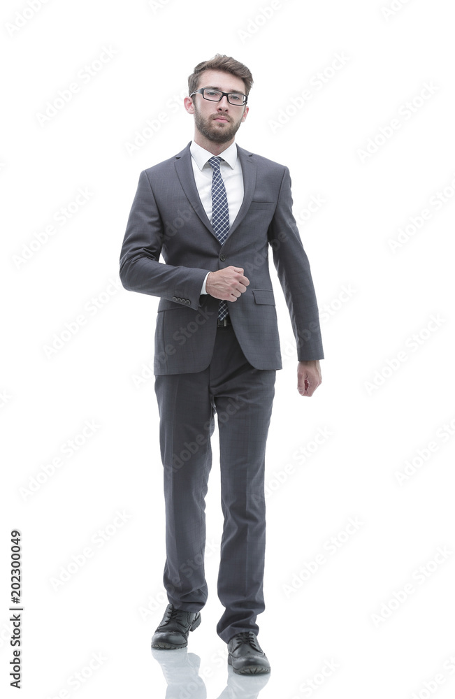 confident businessman goes forward. photo in full growth. confident businessman goes forward. photo in full growth.