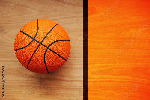 Basketball ball on court floor © Bits and Splits