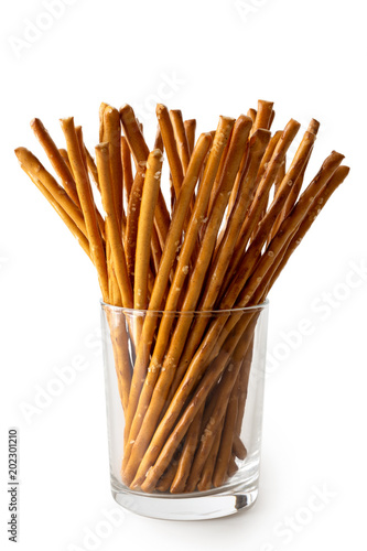 Εκτύπωση καμβά Long crunchy salty pretzel sticks in glass isolated on white.