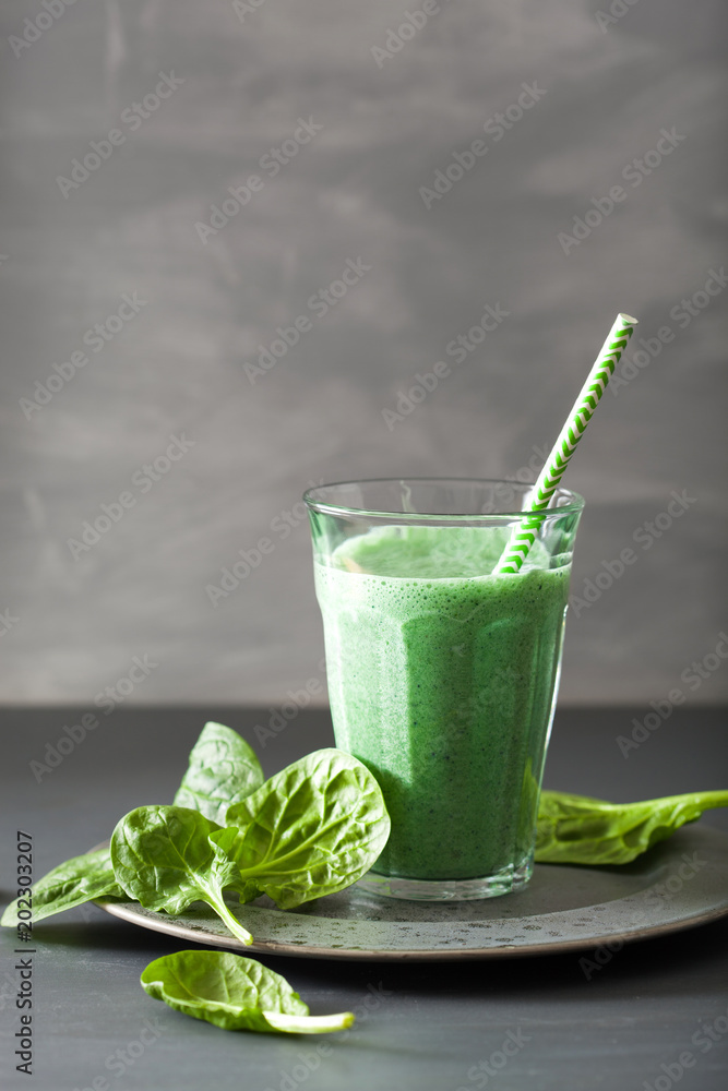 Fototapeta premium green spinach smoothie with spirulina, chia seed, lime, apple