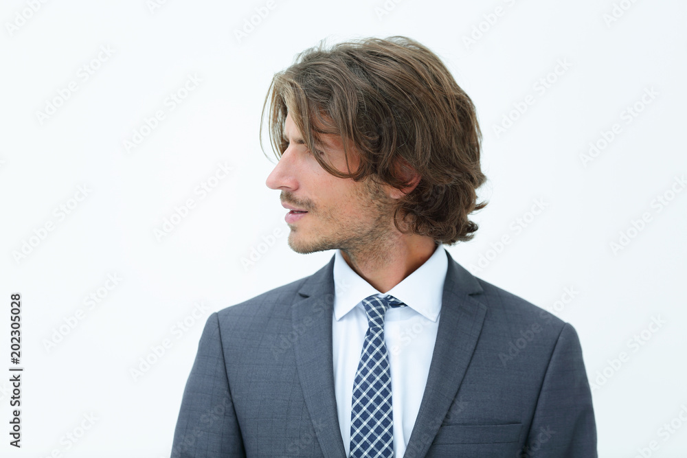 Handsome man in stylish clothes is looking away and smiling Handsome man in stylish clothes is looking away and smiling