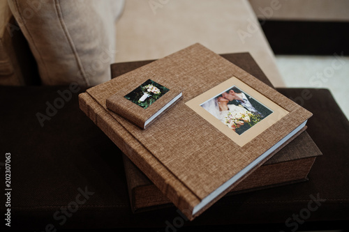 Brown textile wedding photo book or album.