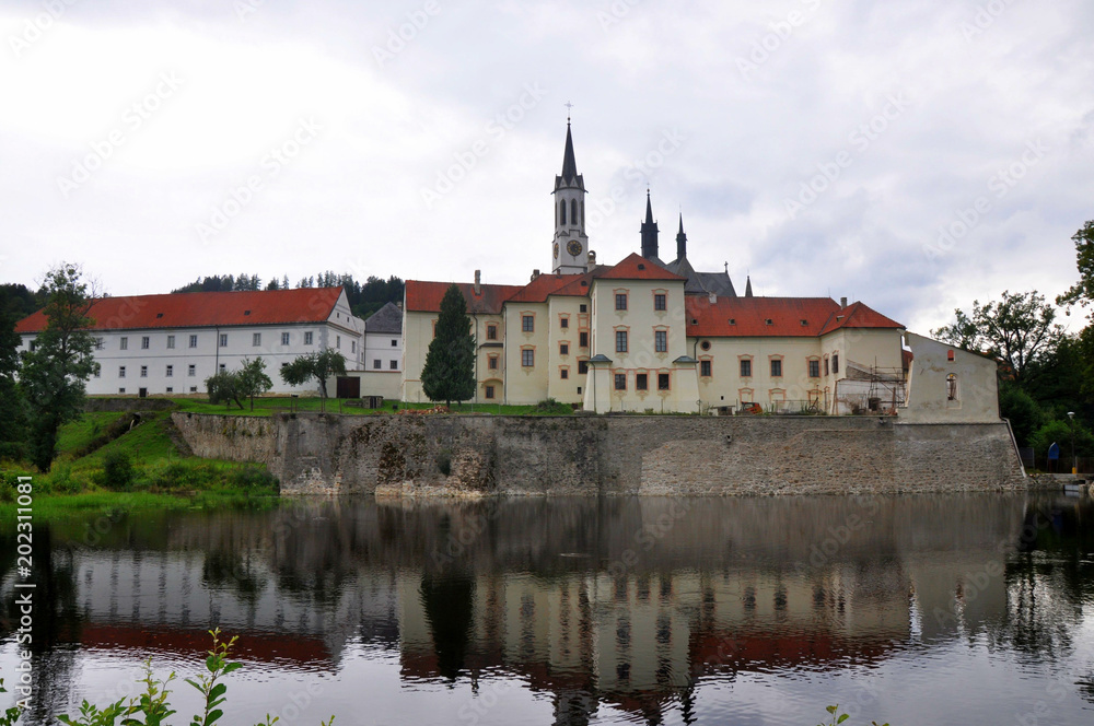 Vyssi Brod  cistercian monastery in south Bohemia reflected in water, Czech republic.