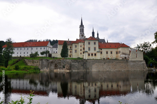 Vyssi Brod cistercian monastery in south Bohemia reflected in water, Czech republic.