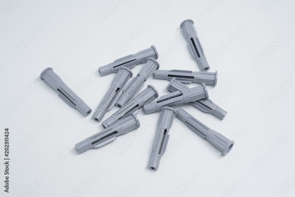 Dowels and screws on a white background Dowels and screws on a white background