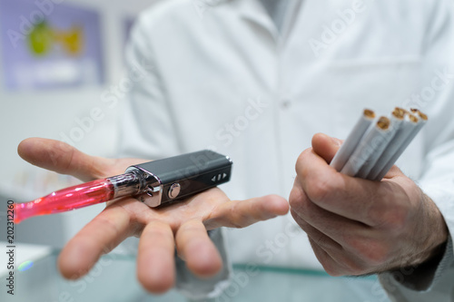 doctor is analysing health effect of electronic cigarette or vaporizer photo