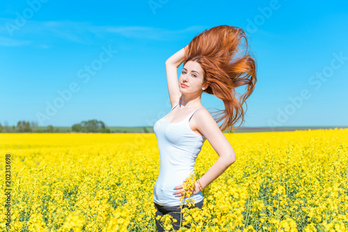 Beauty Girl enjoying nature on the field. Beautiful slim Woman Outdoor in sunlight rays. Sun Light. Free Lady. Health care concept 
