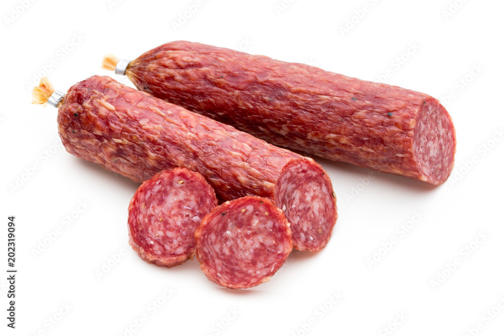 Salami smoked sausage, basil leaves and peppercorns isolated on white background. Salami smoked sausage, basil leaves and peppercorns isolated on white background.