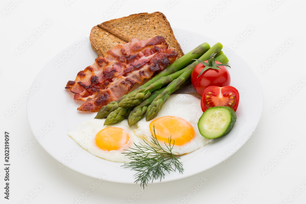 Fried eggs with bacon on the wooden table. Fried eggs with bacon on the wooden table.