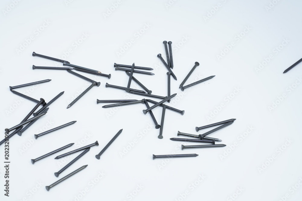 Hammer with pins on white background Hammer with pins on white background