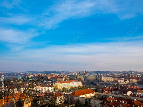 Prague Czech Republic cityscape view blue sky orange roof space old town building landmark historical city. © Chitsanupong