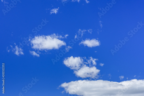 White fluffy clouds in a deep blue sky