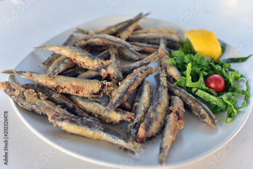 Plate of Sardines with a Lemon and vegetables, Milos Island, Greece