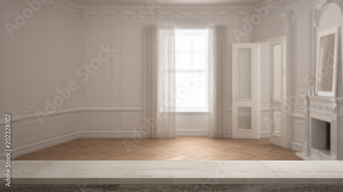 Wooden vintage table top or shelf closeup  zen mood  over blurred classic empty room with big window with fireplace  white architecture interior design