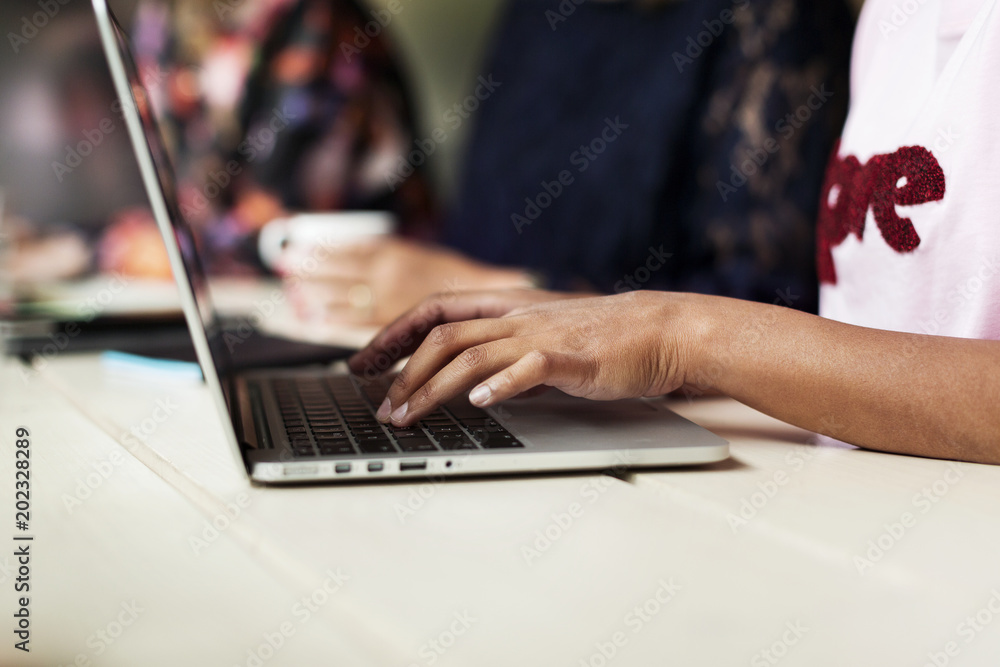 Woman using laptop in cafe Woman using laptop in cafe