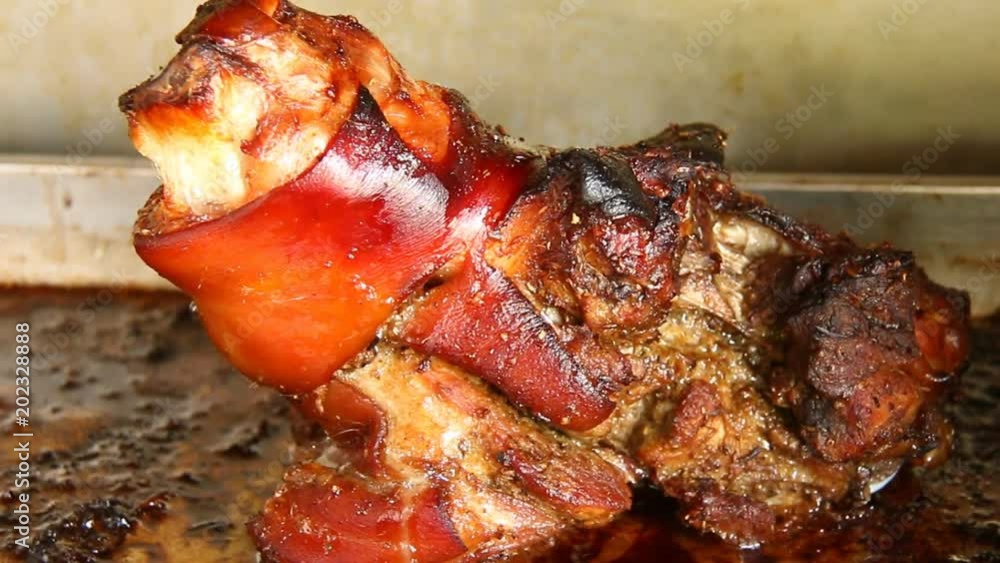 Roasted pork leg in the oven Stock Video Adobe Stock