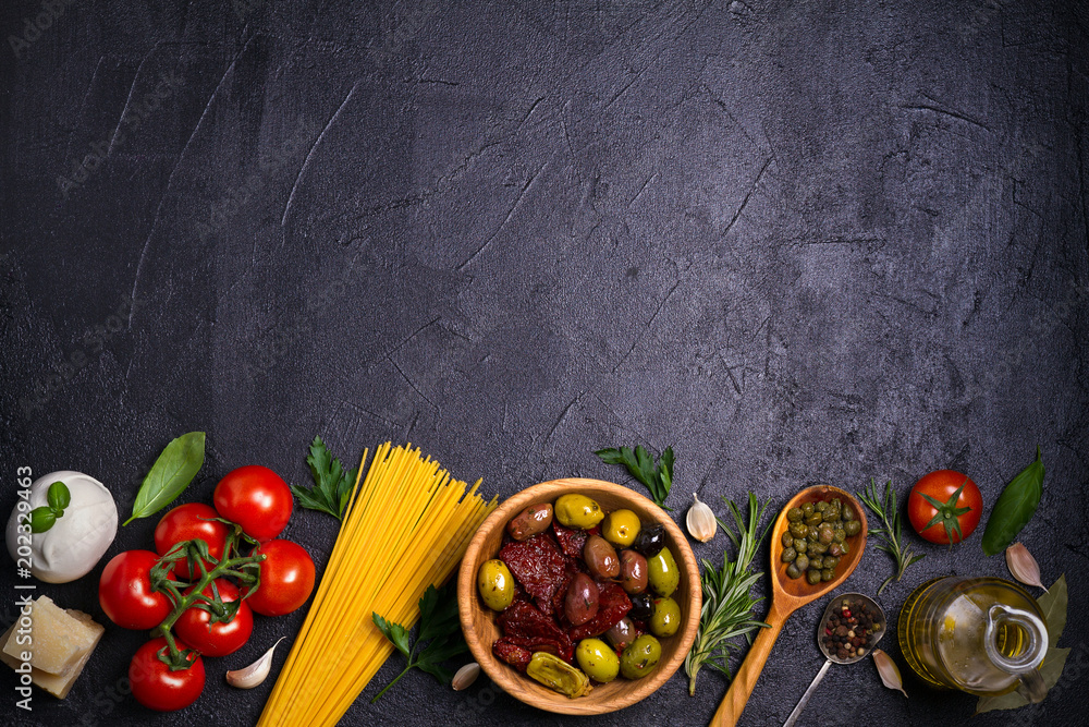 Selection of healthy food. Italian food background with spaghetti,  mozzarella parmesan cheese, olives, tomatoes and rosemary. Vegetarian food  banner. overhead, horizontal Stock Photo | Adobe Stock