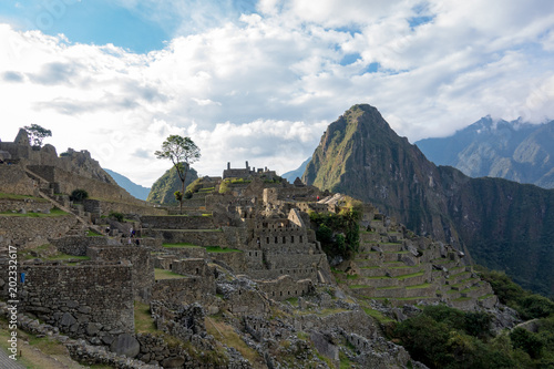 Houses and terraces of Machu Picchu during sunset