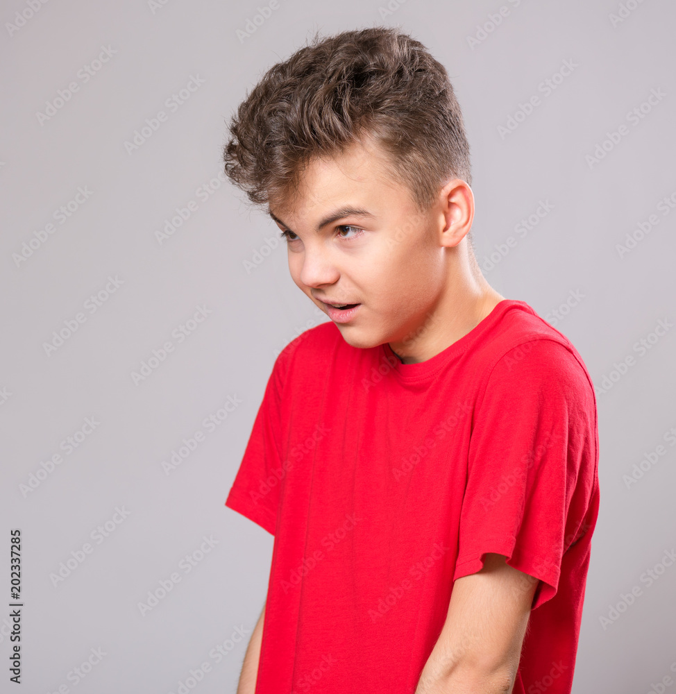 Close up profile emotional portrait of caucasian teen boy. Handsome sad  guy. Funny cut teenager on gray background. Child looking away. Stock Photo  | Adobe Stock