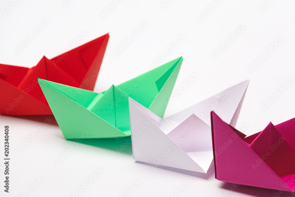 Set of origami paper boats. Leadership and business concept Set of origami paper boats. Leadership and business concept