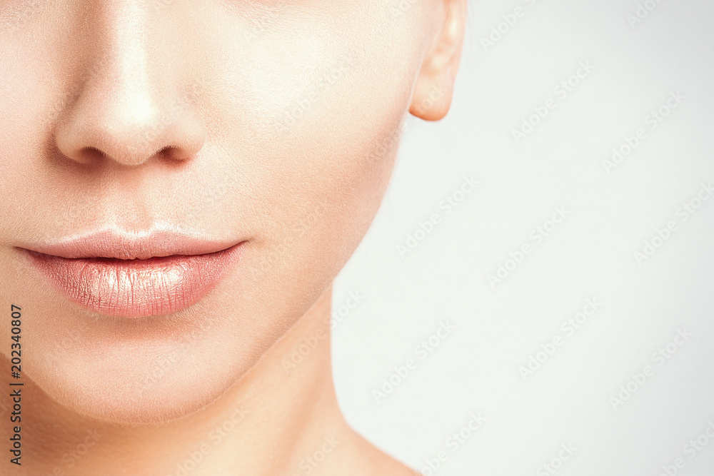 Woman beautiful face portrait on gray background. Beauty Portrait. Beautiful Spa model Girl with Perfect Fresh Clean Skin. Blonde female looking at camera. Youth and Skin Care Concept. Woman beautiful face portrait on gray background. Beauty Portrait. Beautiful Spa model Girl with Perfect Fresh Clean Skin. Blonde female looking at camera. Youth and Skin Care Concept.