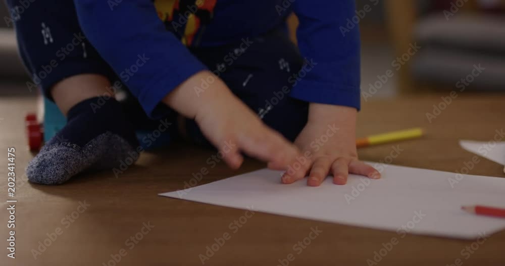 Toddler throwing paper and toys - close up Toddler throwing paper and toys - close up