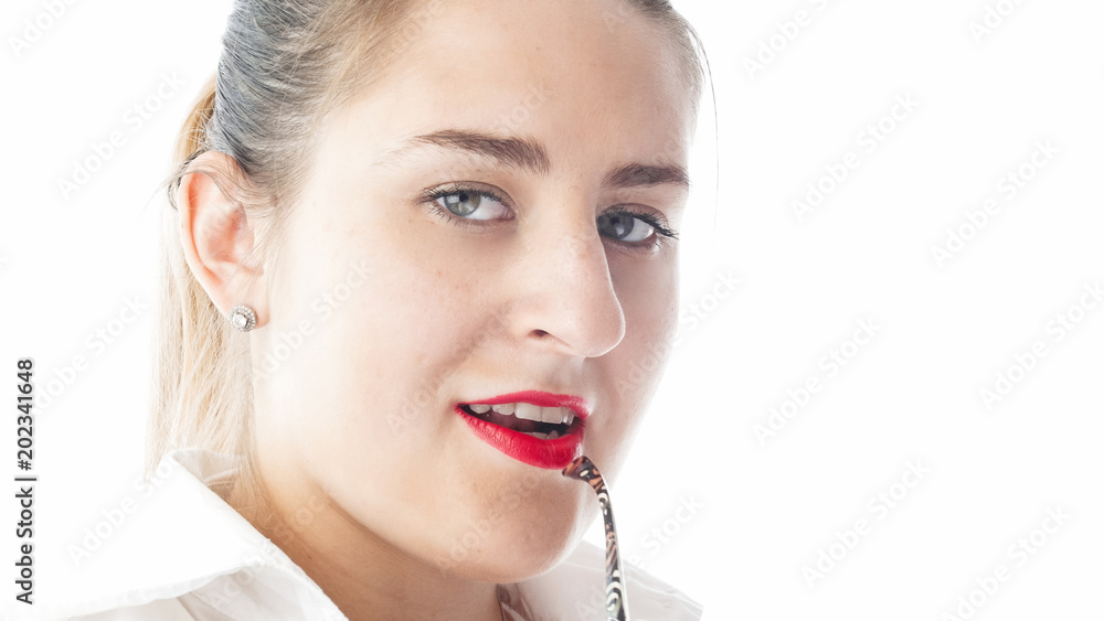 Closeup isolated portrait of sexy young businesswoman holding eyeglasses earpiece in mouth Closeup isolated portrait of sexy young businesswoman holding eyeglasses earpiece in mouth