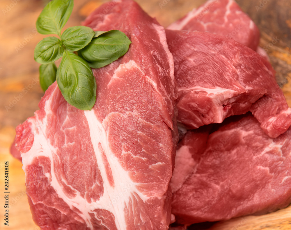 raw pork on a background of mango boards raw pork on a background of mango boards