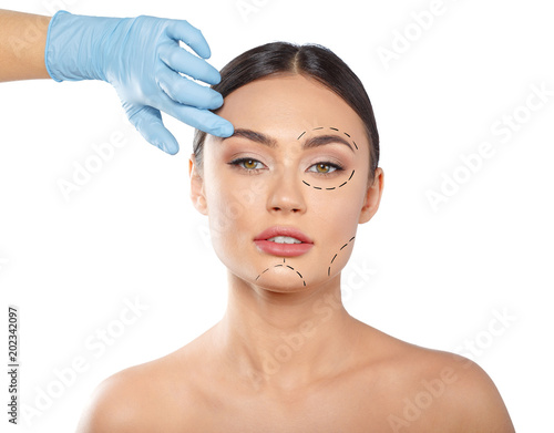 woman with dotted lines on face, cosmetology