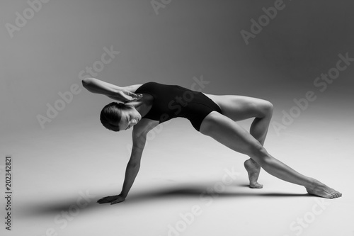 Young beautiful athlete is posing in studio