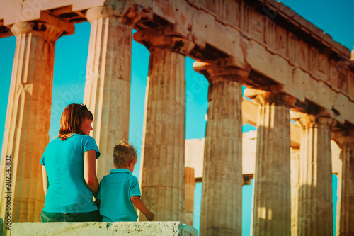 mother and son travel in Greece, lookint at ancient buildings