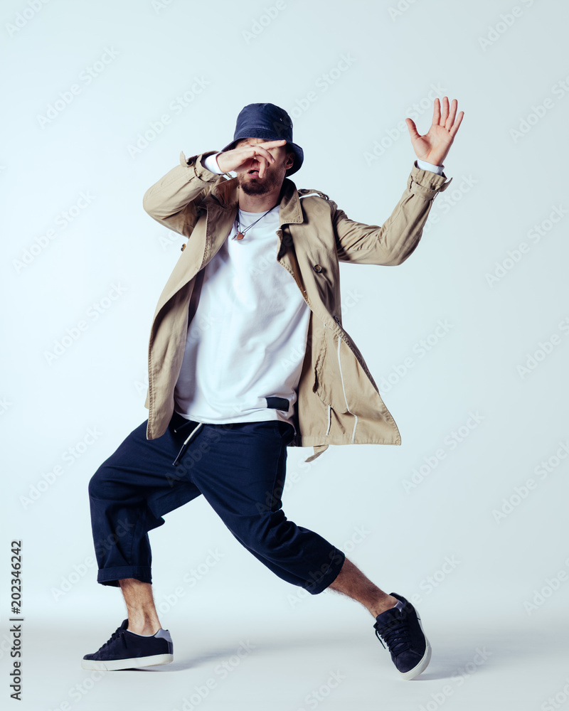 Young beautiful male dancer posing in studio Young beautiful male dancer posing in studio