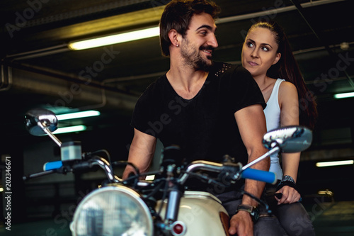 Biker man trying to cheer up his angry girlfriend © sasamihajlovic