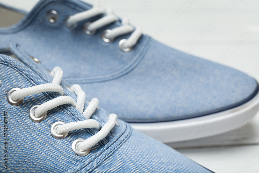Summer casual sneakers and white laces on a white background. Summer casual sneakers and white laces on a white background.