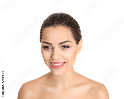 Young woman with beautiful makeup on white background. Professional cosmetic products