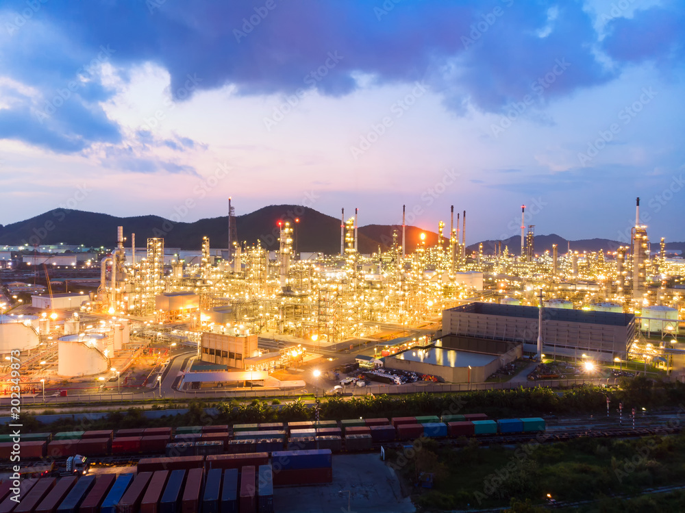 Aerial view of steel pipe oil refinery plant, power plant at sunset sky for industry concept.