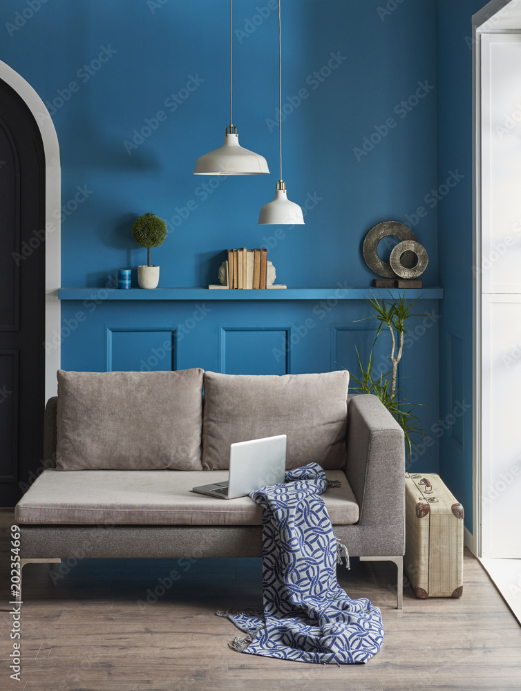 blue wall living room with black door and grey sofa style. dark blue  blanket. Stock Photo | Adobe Stock