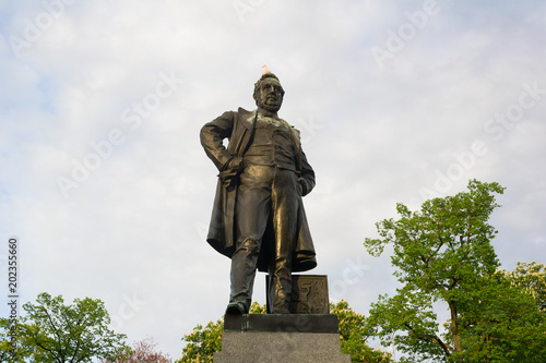 Statue of Frantisek Ladisslav Rieger, Rieger gardens, Prague, Czech Republic / Czechia - bronze sculpture of Czech nationalist politician. Landmark, monument and memorial in the park. Evening light photo