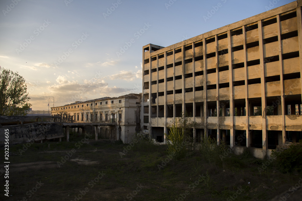 abandoned old factory at sunset