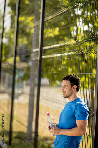 Young man drinking water