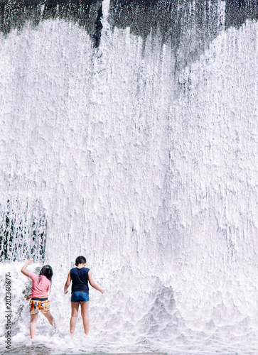 Fototapeta Naklejka Na Ścianę i Meble -  Kids fun waterfall villa escudero, San Pablo, Philippines